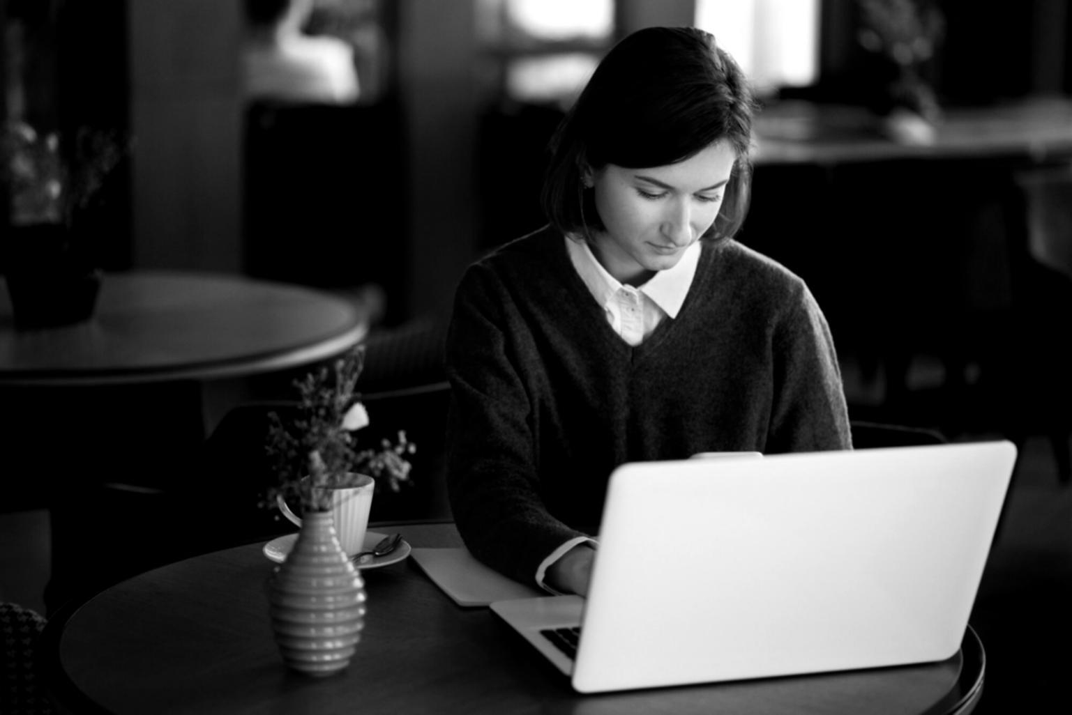 Business professional reviewing financial documents and charts